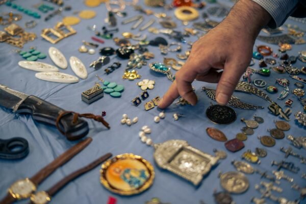 A diverse collection of jewelry and trinkets displayed at a bazaar in İstanbul, Türkiye.